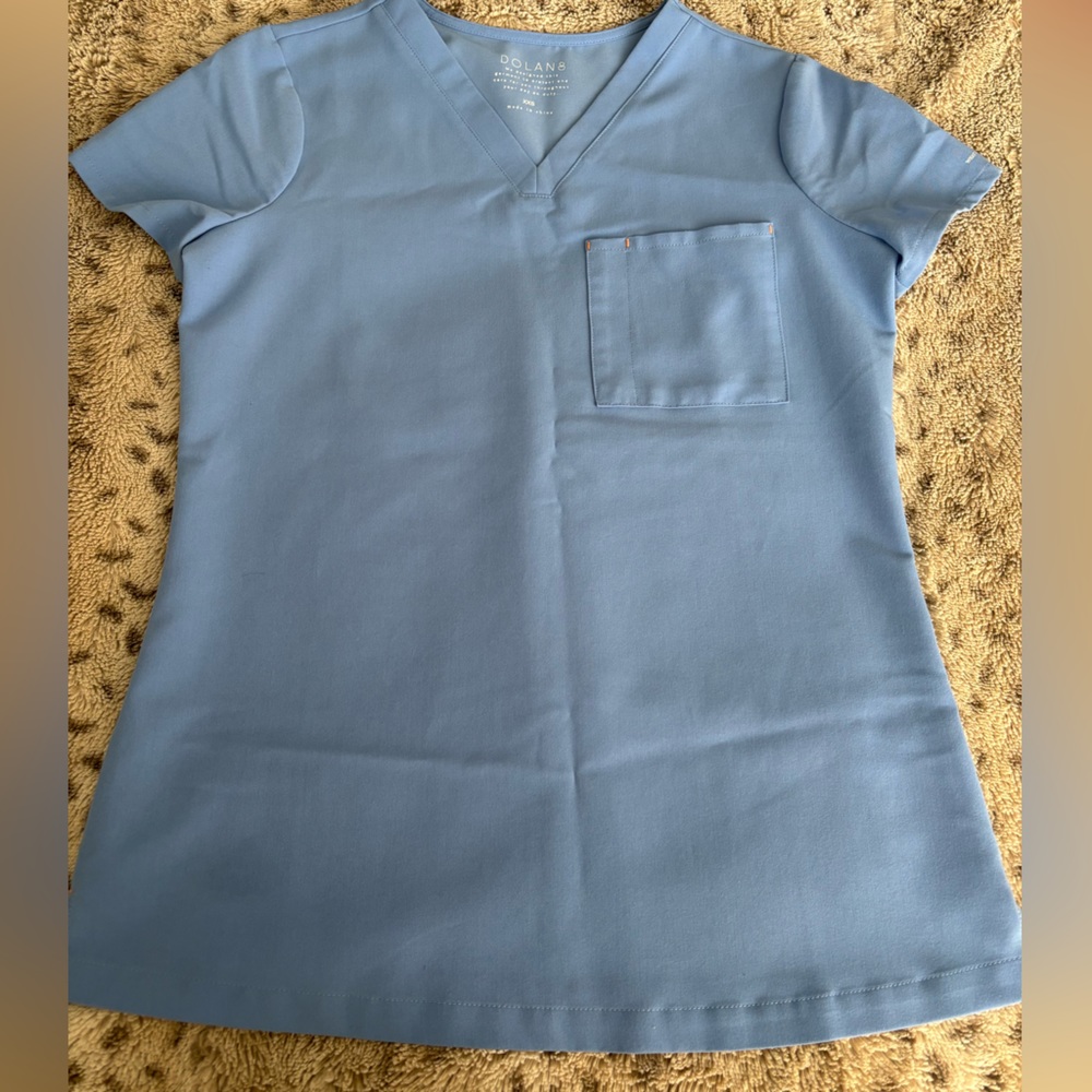 Light blue Dolan scrub top. XXS.